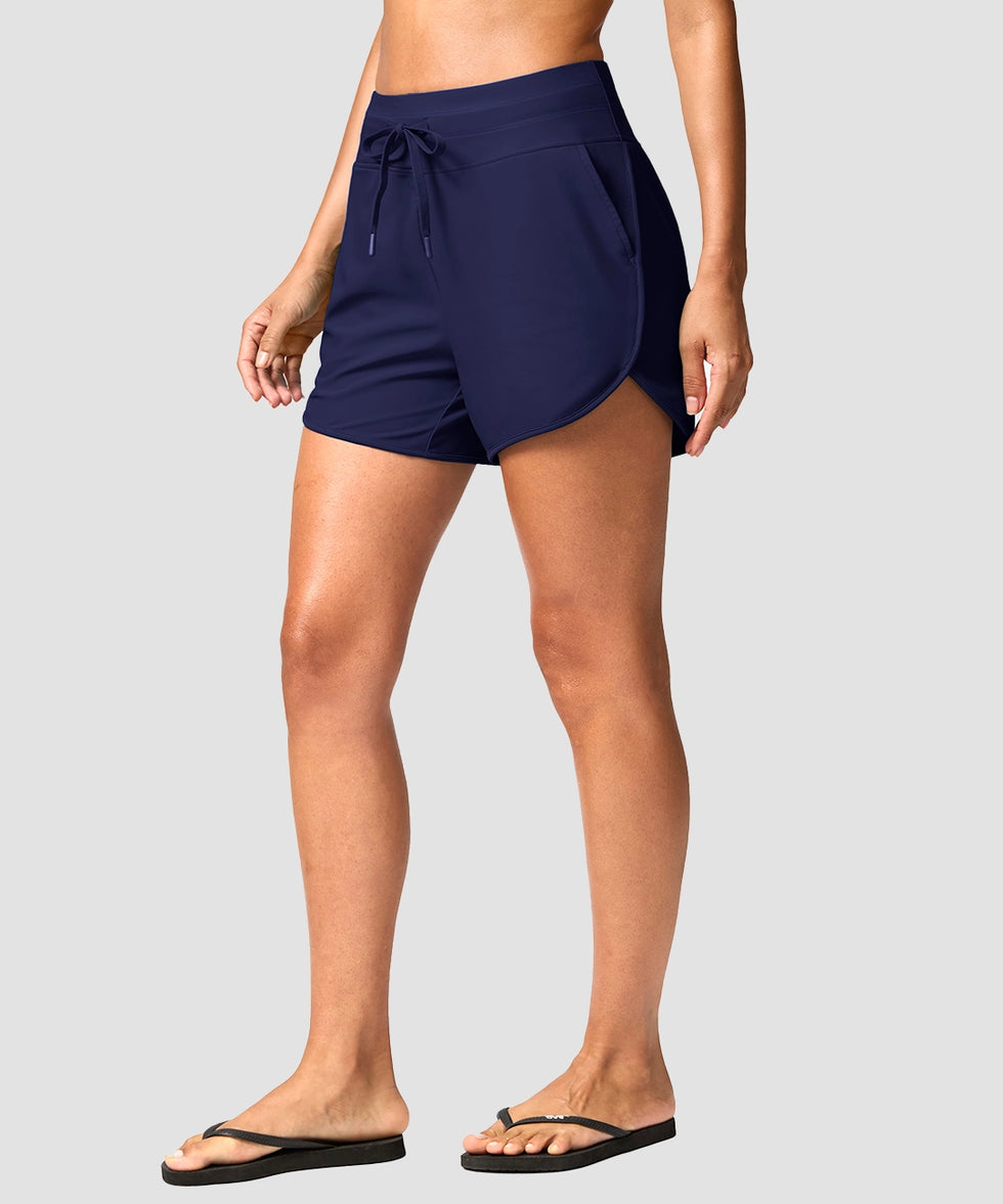 g-drykit™ high waisted pocket swim shorts in navy - on model side view