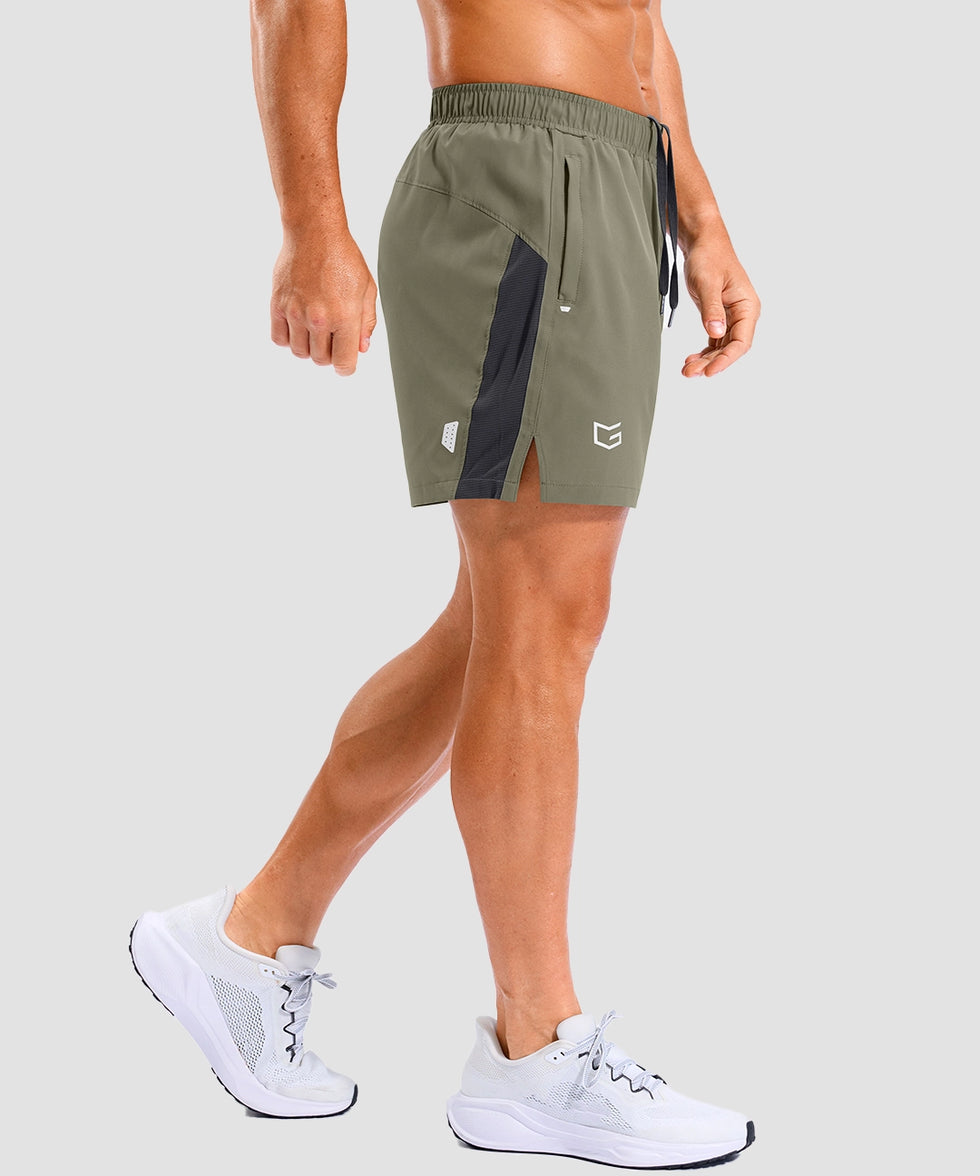 lightweight 5 inch pocketed athletic shorts in gray sage - on model side view