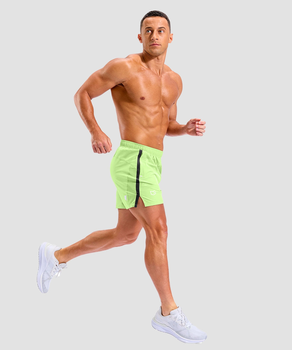lightweight 5" pocketed athletic shorts in bright green - on model side view