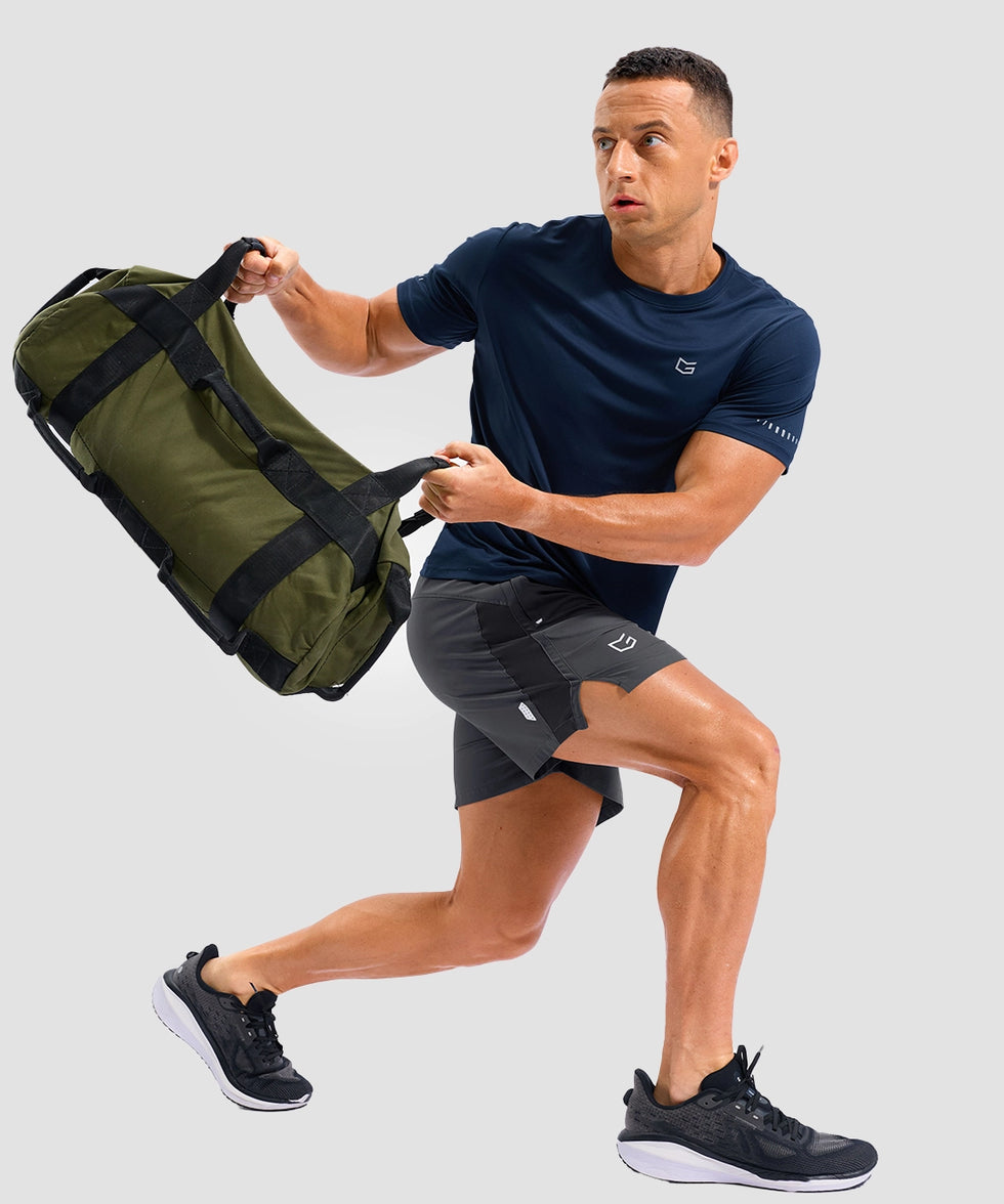 lightweight 5" pocketed athletic shorts in dark gray - on model view