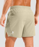 lightweight 5" pocketed athletic shorts in light khaki - back view