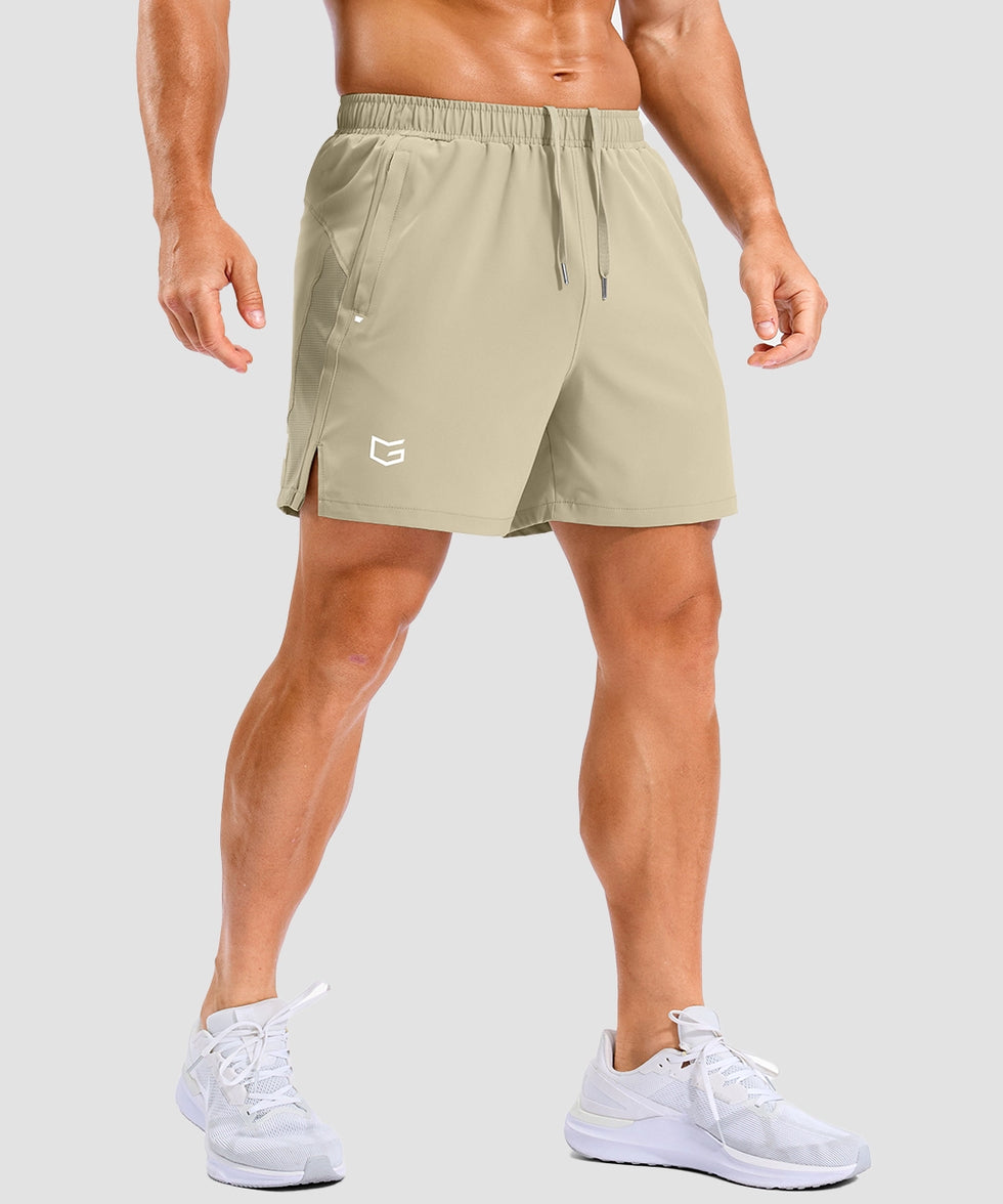 lightweight 5" pocketed athletic shorts in light khaki - on model front view