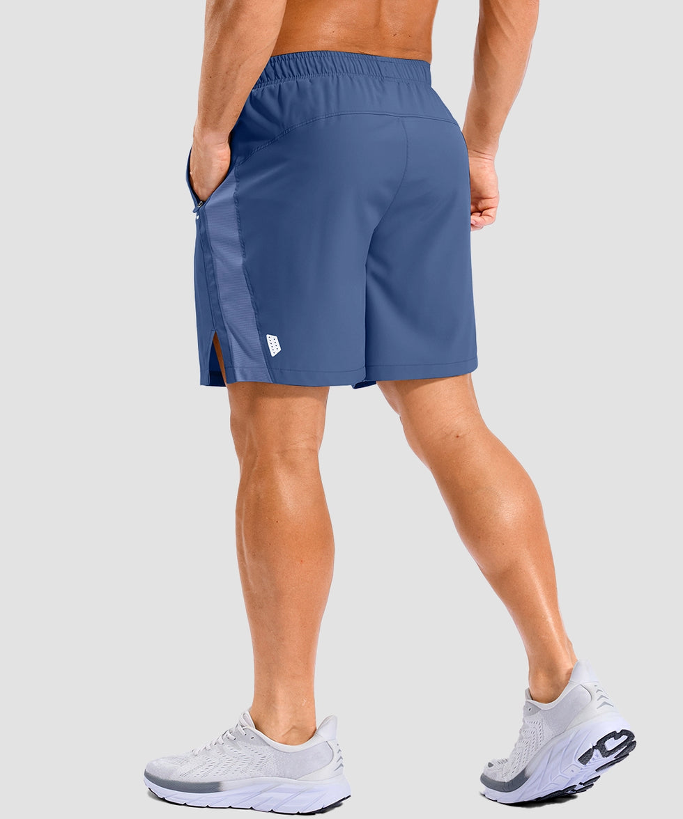 lightweight 7" pocketed athletic shorts in dusty blue - on model back view