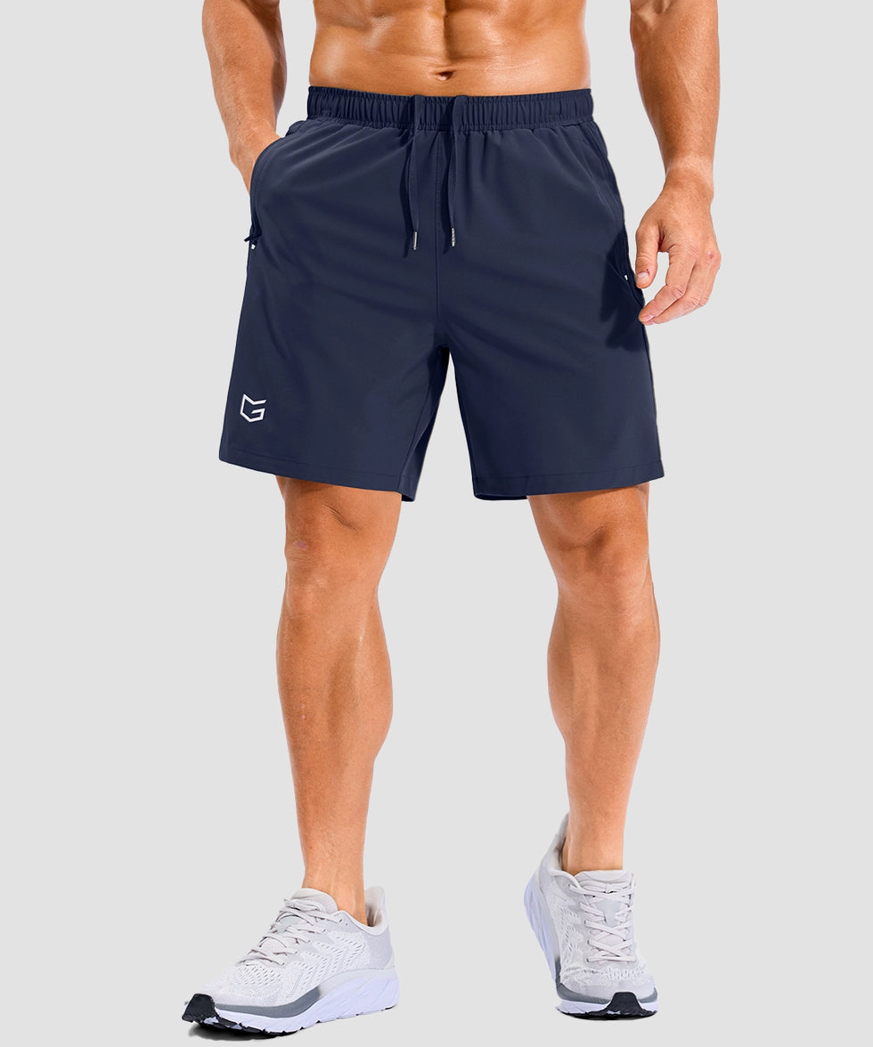 lightweight 7" pocketed athletic shorts in navy - on model front view