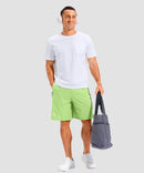 lightweight 9" pocketed athletic shorts in bright green - on model view