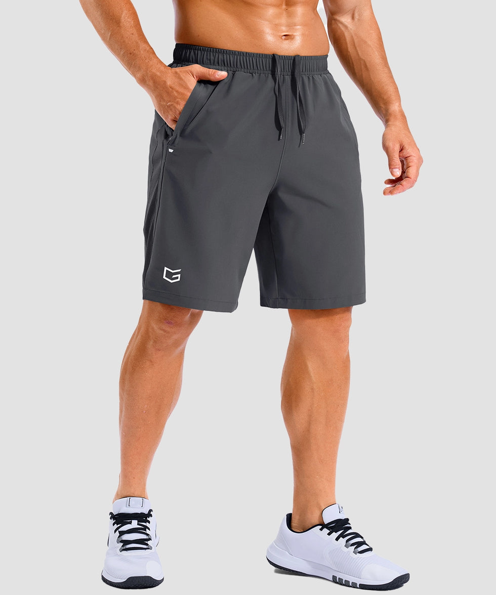 lightweight 9" pocketed athletic shorts in dark gray - on model front view