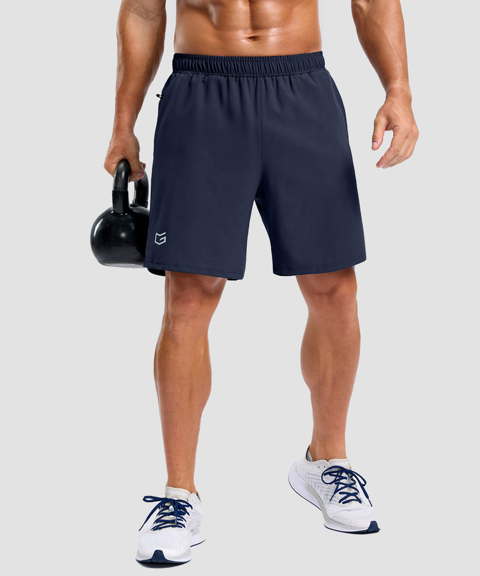 men's elastic waist split hem shorts 7'' in navy - front view