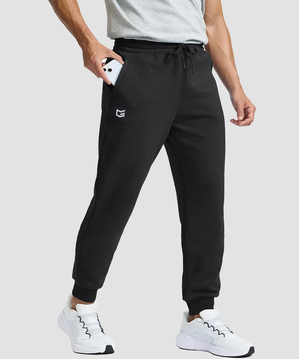 men's fleece-lined cotton joggers in black - zipper pocket detail view