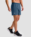 mid rise elastic waist slit short 5" in gray blue - on model side view