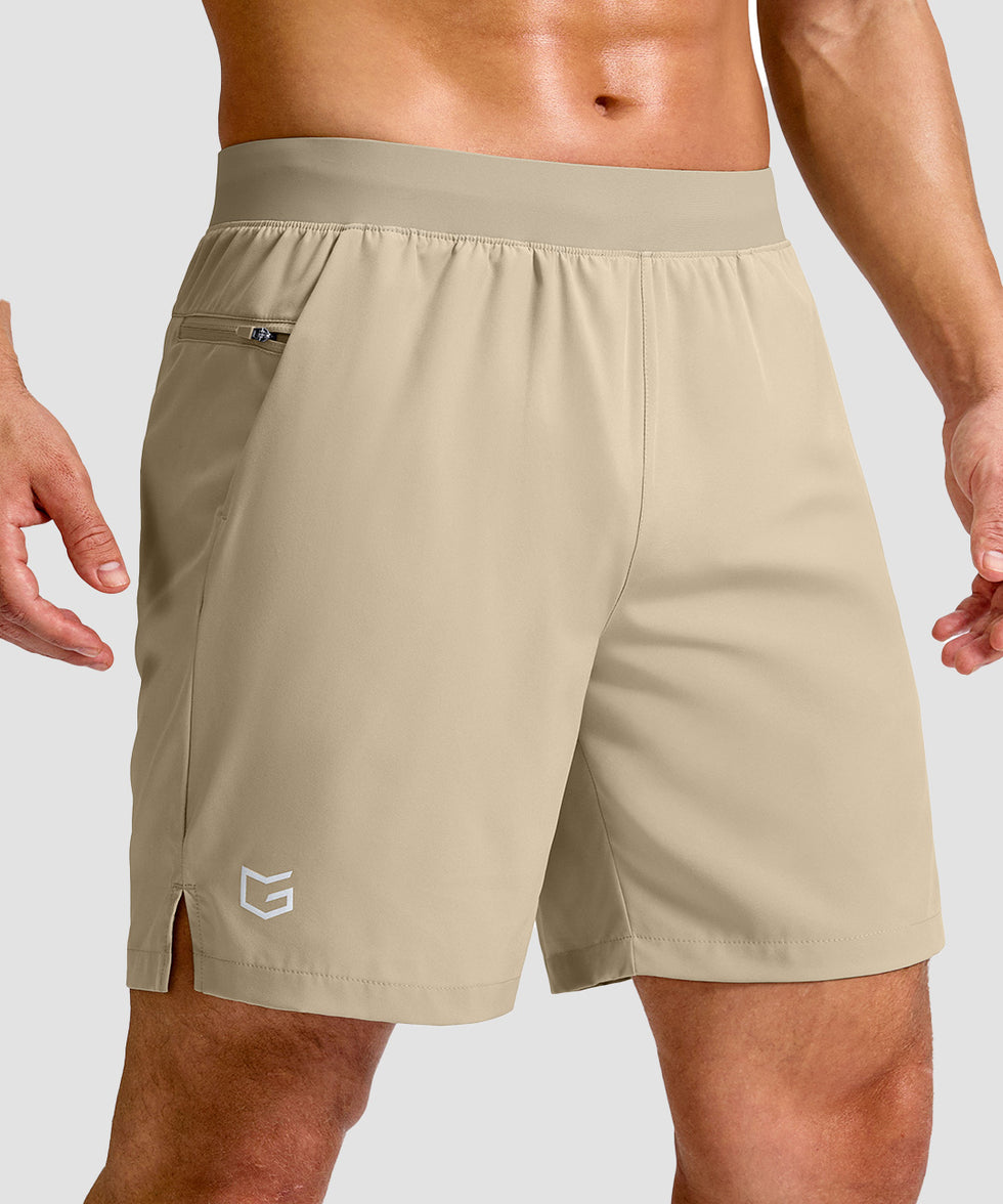 mid rise elastic waist slit short 7" in light khaki - front view