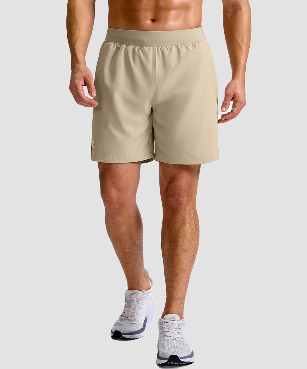 mid rise elastic waist slit short 7" in light khaki - on model front view