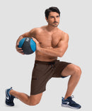 moisture wicking athletic sweat shorts in brown - on model exercise view