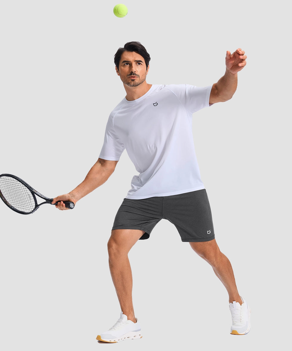moisture wicking athletic sweat shorts in heather gray - on model play tennis view
