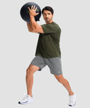 moisture wicking athletic sweat shorts in heather light gray - on model exercise view