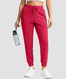 women's drawstring mid waist joggers in red - front view