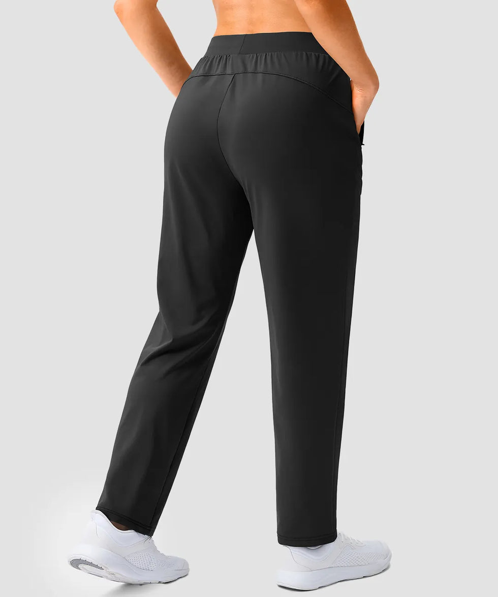 women's elastic waist 2 zip pockets track pants in black - back view