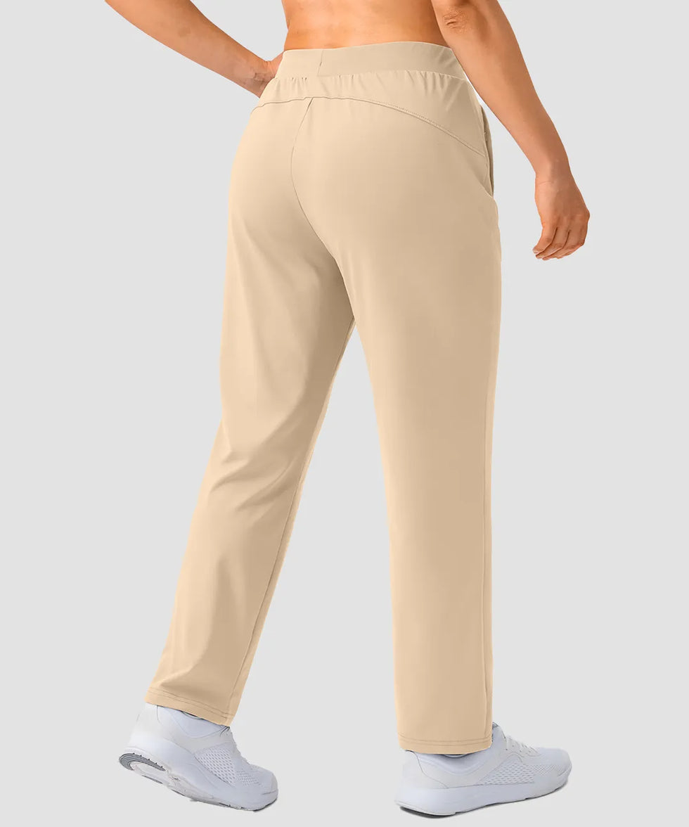 women's elastic waist 2 zip pockets track pants in light khaki - back view