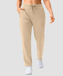 women's elastic waist 2 zip pockets track pants in light khaki - front view