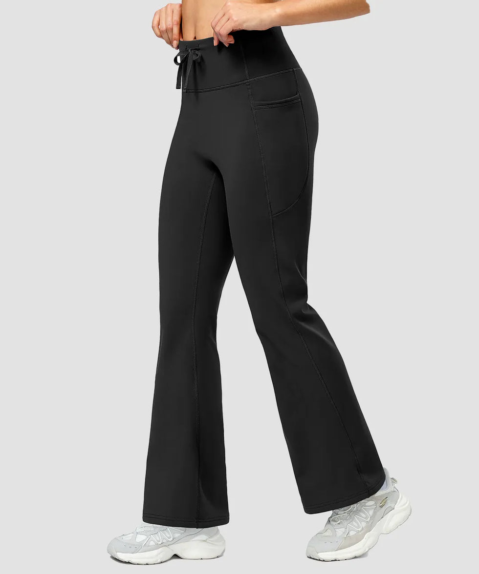 women's fleece lining zip pockets flare leggings in black - side view