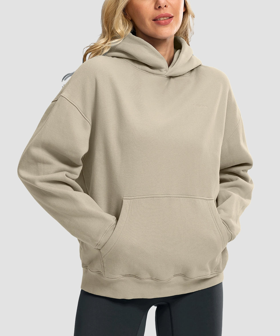 women's solid color oversized fleece hoodie in taupe - front view