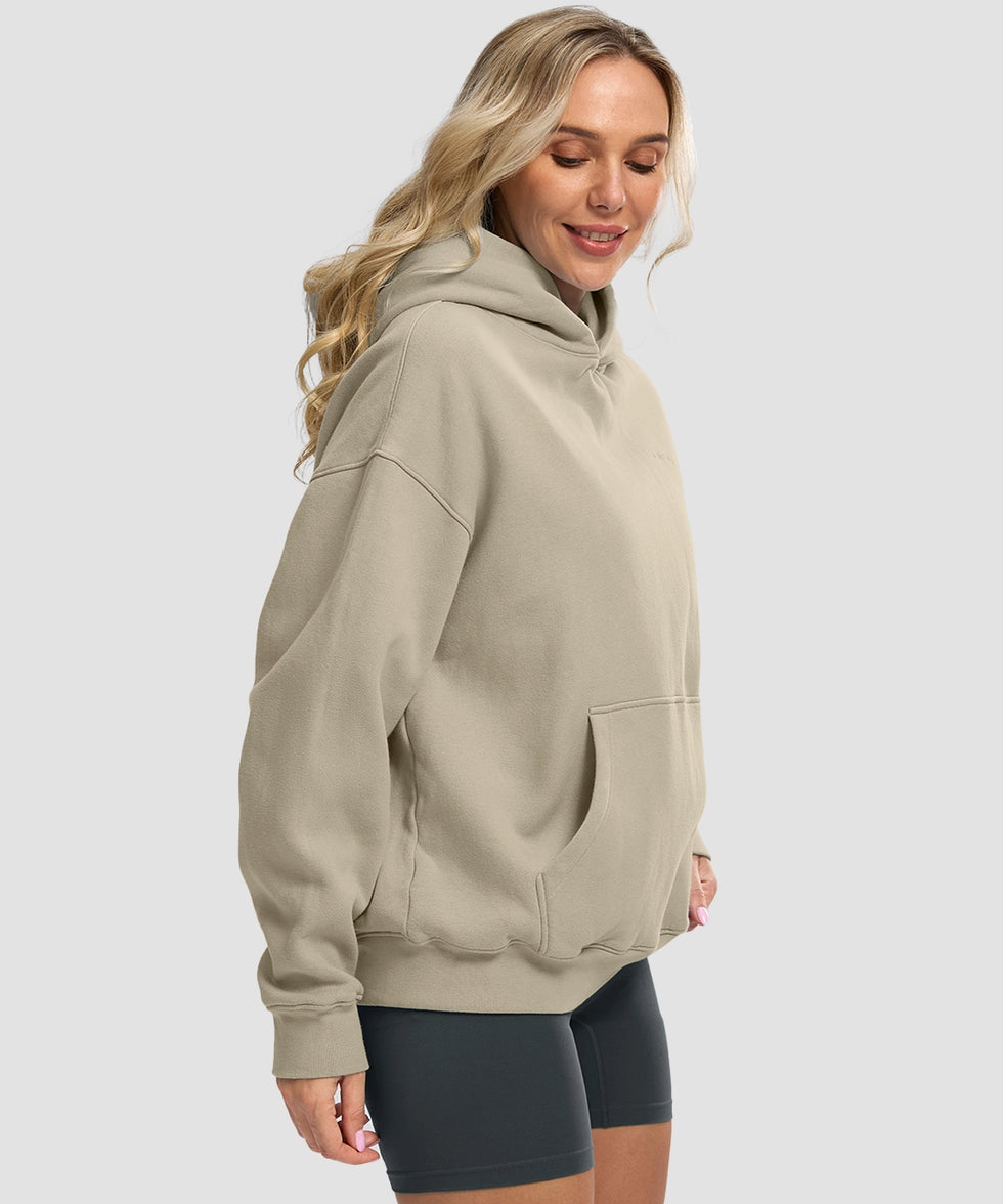 women's solid color oversized fleece hoodie in taupe - side view