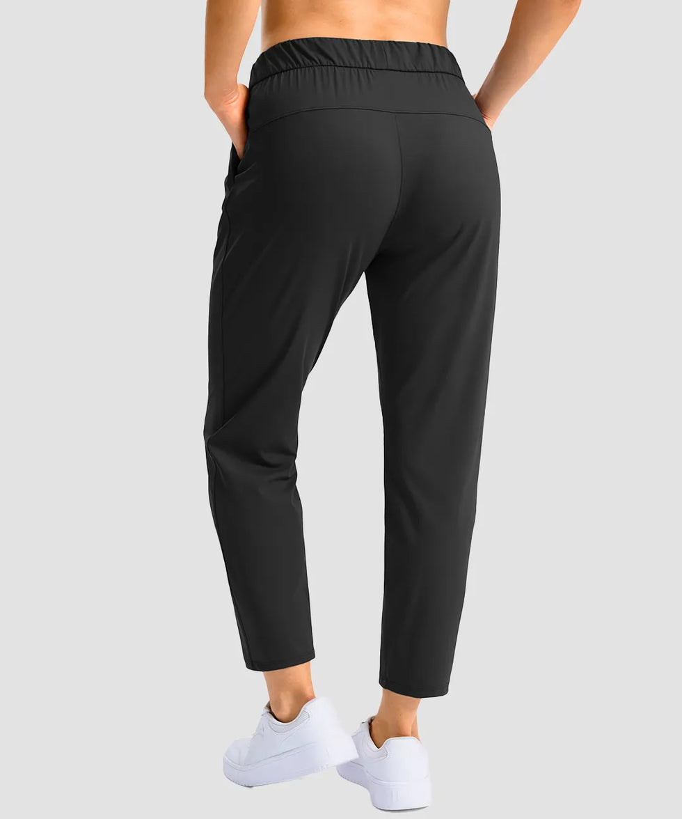 women's stretchy waist with pocket ankle pants in black - back view