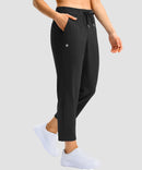 women's stretchy waist with pocket ankle pants in black - side view