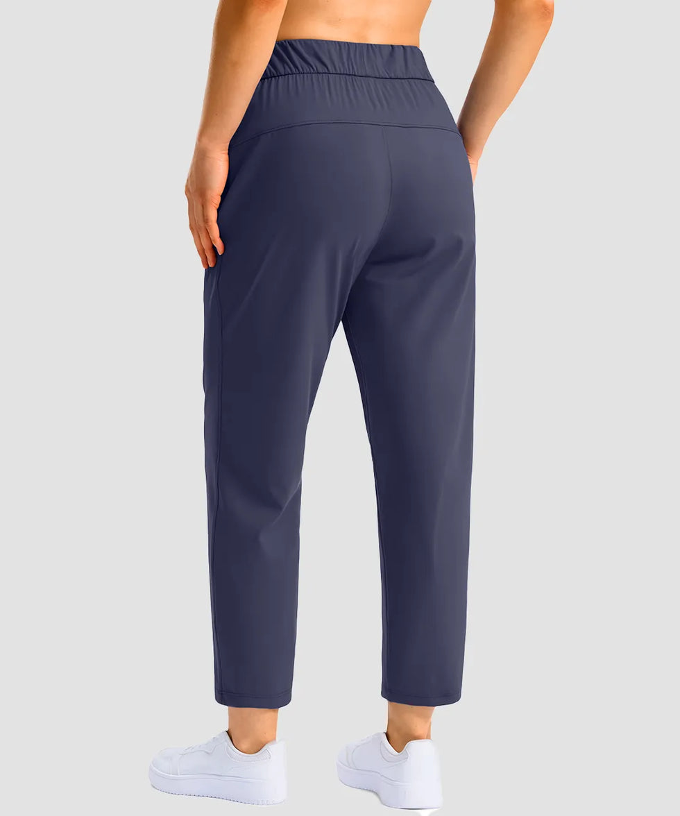 women's stretchy waist with pocket ankle pants in navy - back view