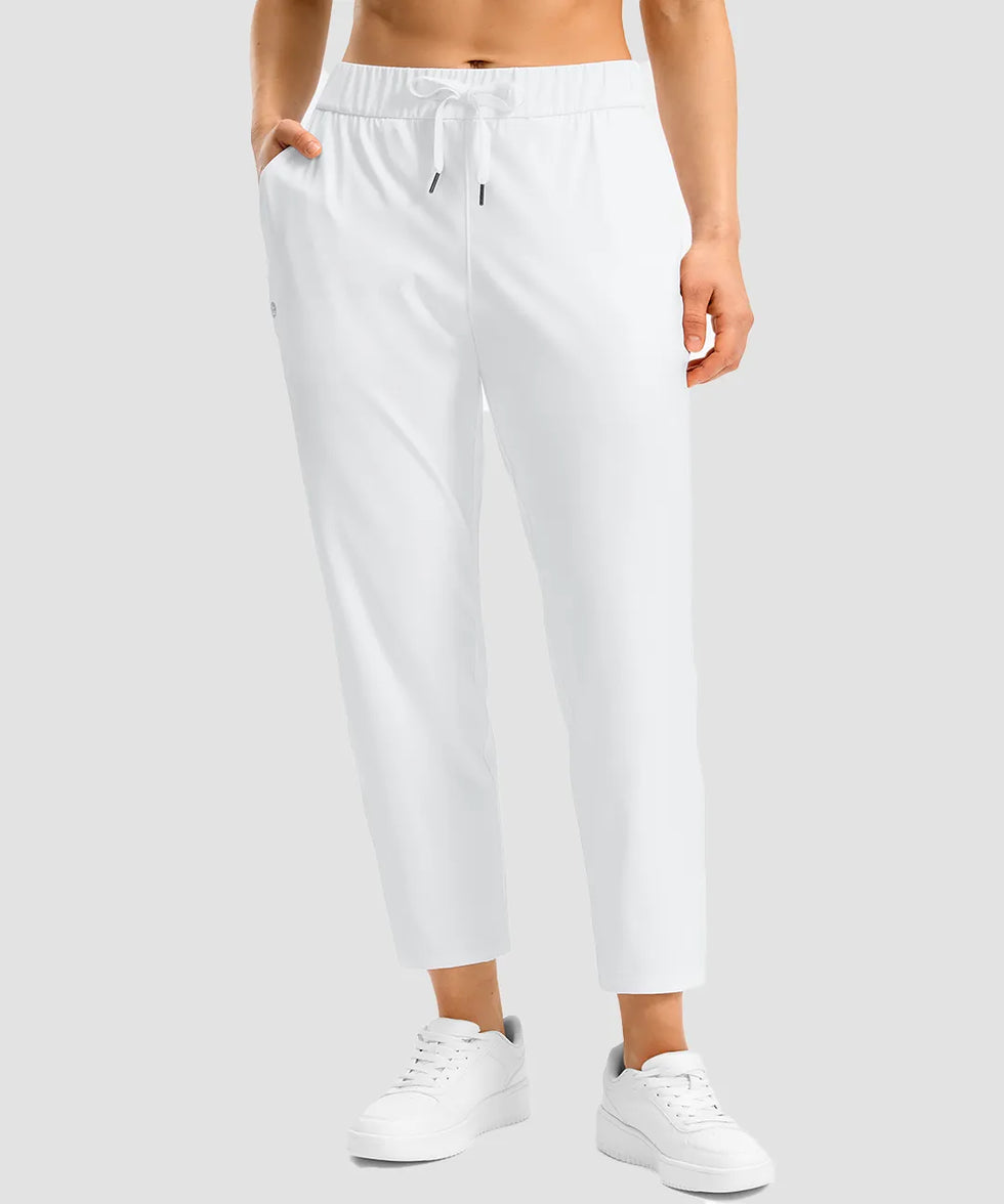 women's stretchy waist with pocket ankle pants in white - front view