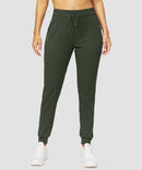 zipper pocket tapered joggers in olive green - front view