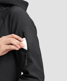fleece-lined softshell jacket in black - pocket detail view