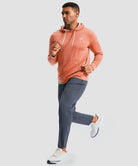 fleece long sleeve hoodie in heather orange on model