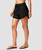 g-drykit™ high waisted pocket swim shorts in black - on model side view