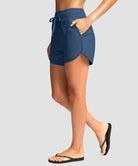 g-drykit™ high waisted pocket swim shorts in dark blue - on model side view