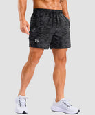 lightweight 5 inch pocketed athletic shorts in black camo - on model front view