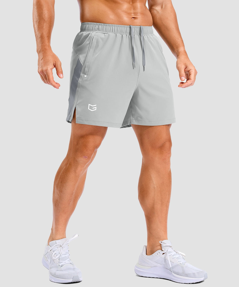 lightweight 5 inch pocketed athletic shorts in bright gray - on model front view