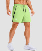 lightweight 5" pocketed athletic shorts in bright green - on model front view