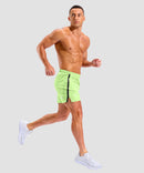 lightweight 5" pocketed athletic shorts in bright green - on model side view