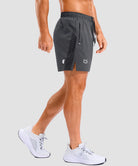lightweight 5" pocketed athletic shorts in dark gray - on model side view