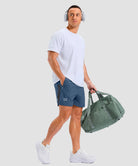 lightweight 5" pocketed athletic shorts in gray blue - on model view