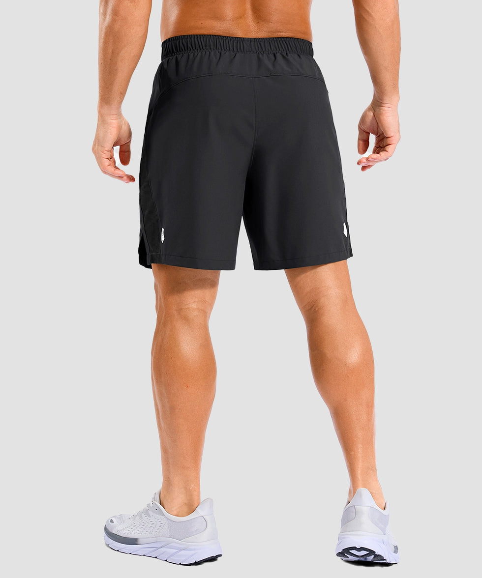 lightweight 7" pocketed athletic shorts in black - on model back view