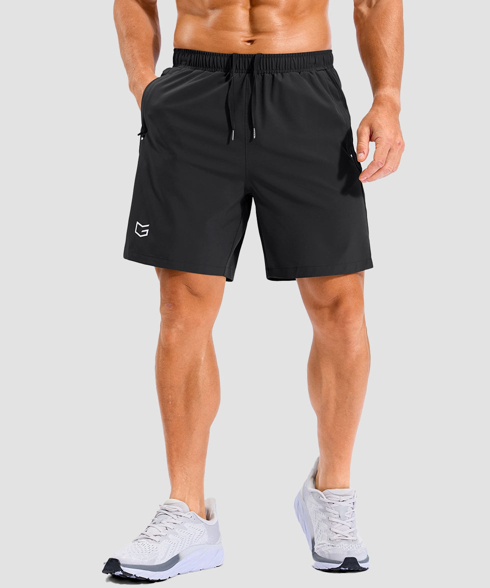 lightweight 7" pocketed athletic shorts in black - on model front view