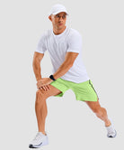 lightweight 7" pocketed athletic shorts in bright green - on model view