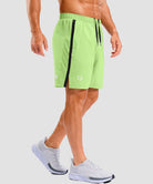 lightweight 7" pocketed athletic shorts in bright green - on model side view