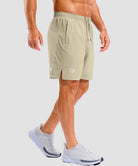 lightweight 7" pocketed athletic shorts in light khaki - on model side view