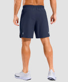 lightweight 7" pocketed athletic shorts in navy - on model back view