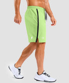 lightweight 9" pocketed athletic shorts in bright green - on model side view