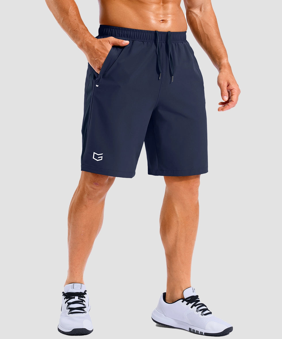 lightweight 9" pocketed athletic shorts in navy - on model front view
