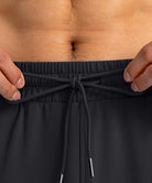 men's drawstring with 3 zipper pockets pant in black - waistband detail view