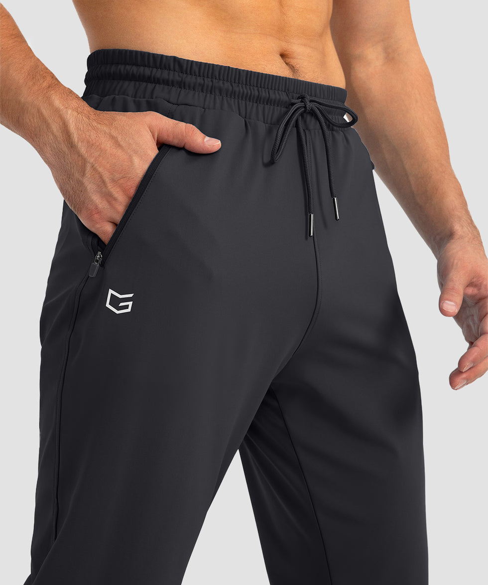 men's drawstring with 3 zipper pockets pant in black - zipper pocket detail view